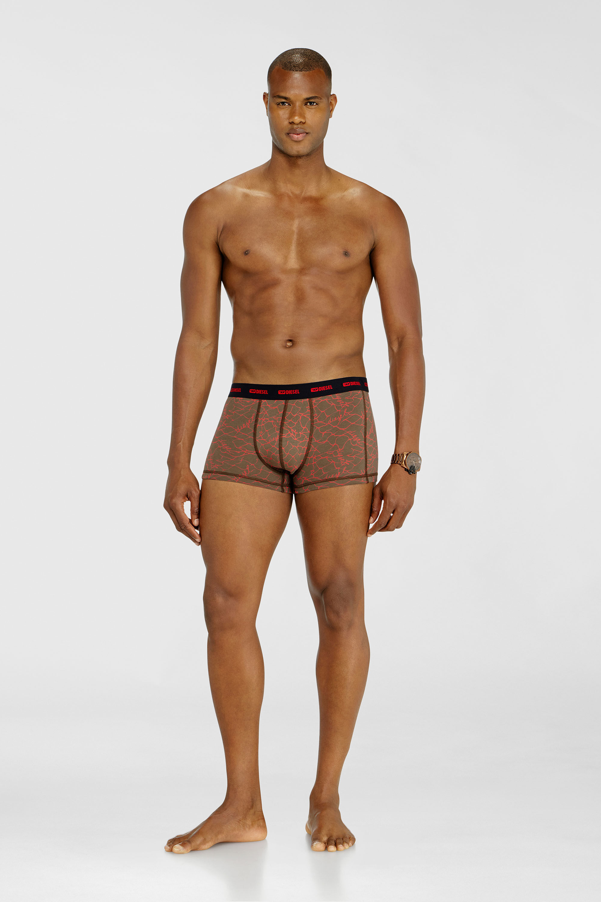 Diesel - DAMIEN-UTLT-3PACK, Herren Dreierpack Trunks mit grafischem Motiv in Schwarz/Braun - 1