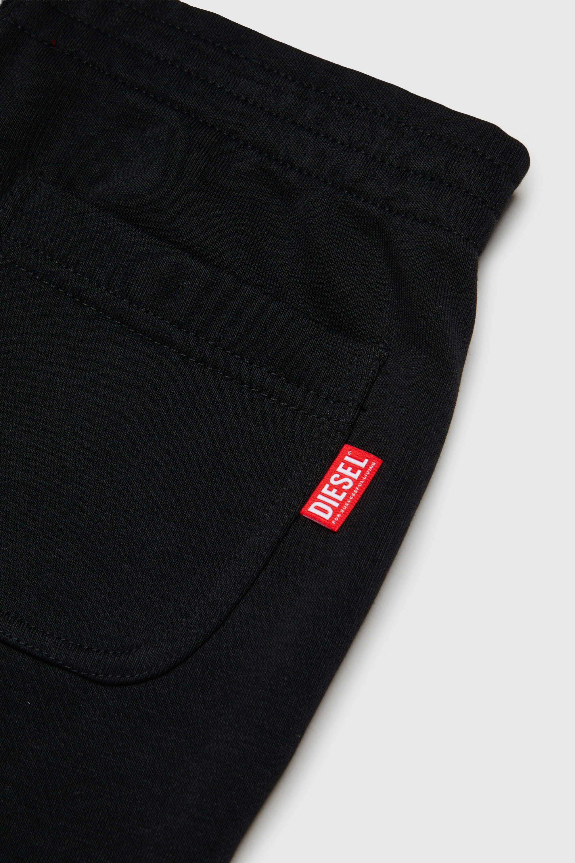 Diesel - PRES, Pantaloni da tuta con stampa logo cut-off Uomo in Nero - 4