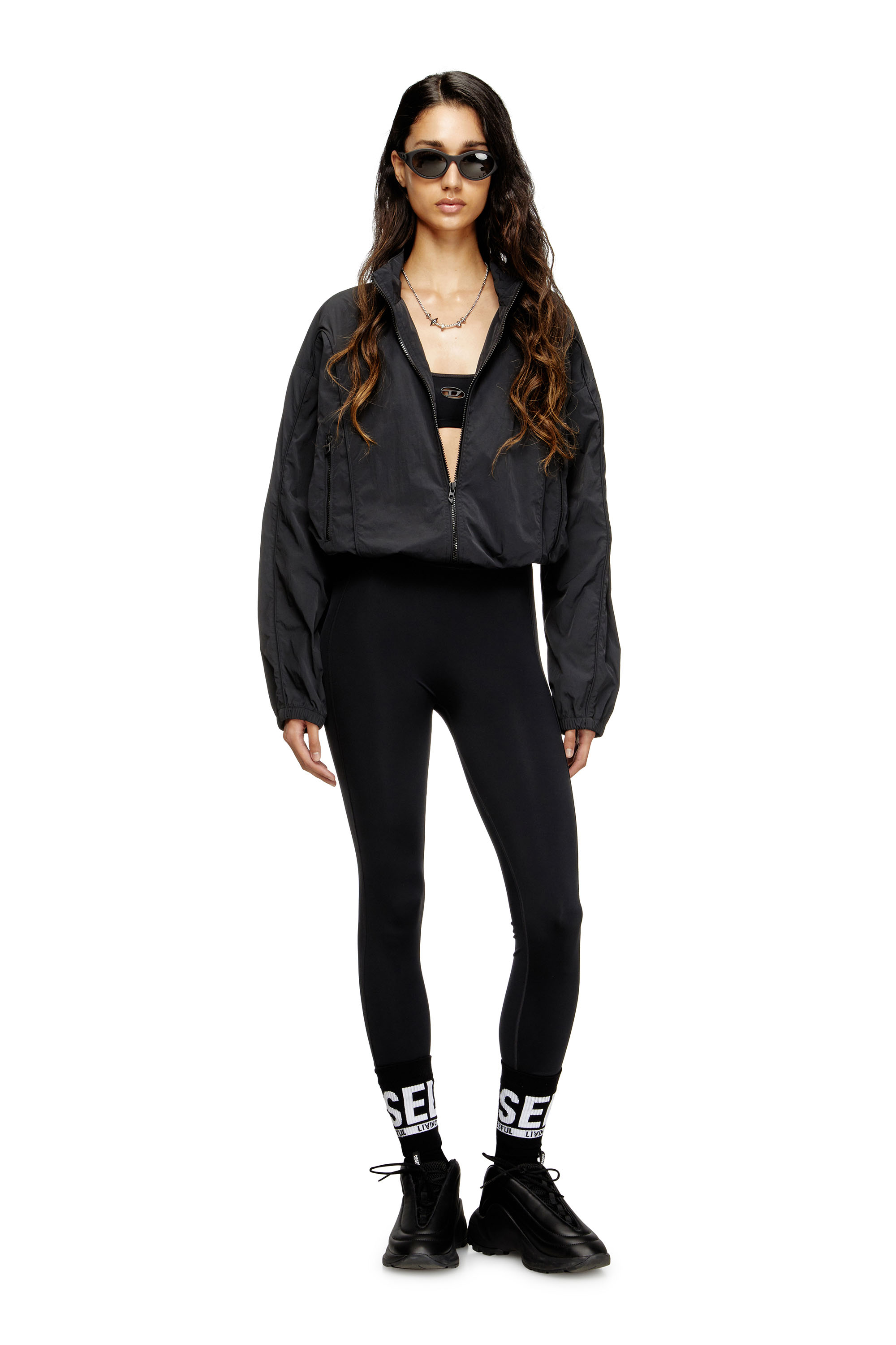 Diesel - MEREDITH-UTLT, Leggings en nylon &agrave; dos d&eacute;coup&eacute; Oval D Femme in Noir - 4