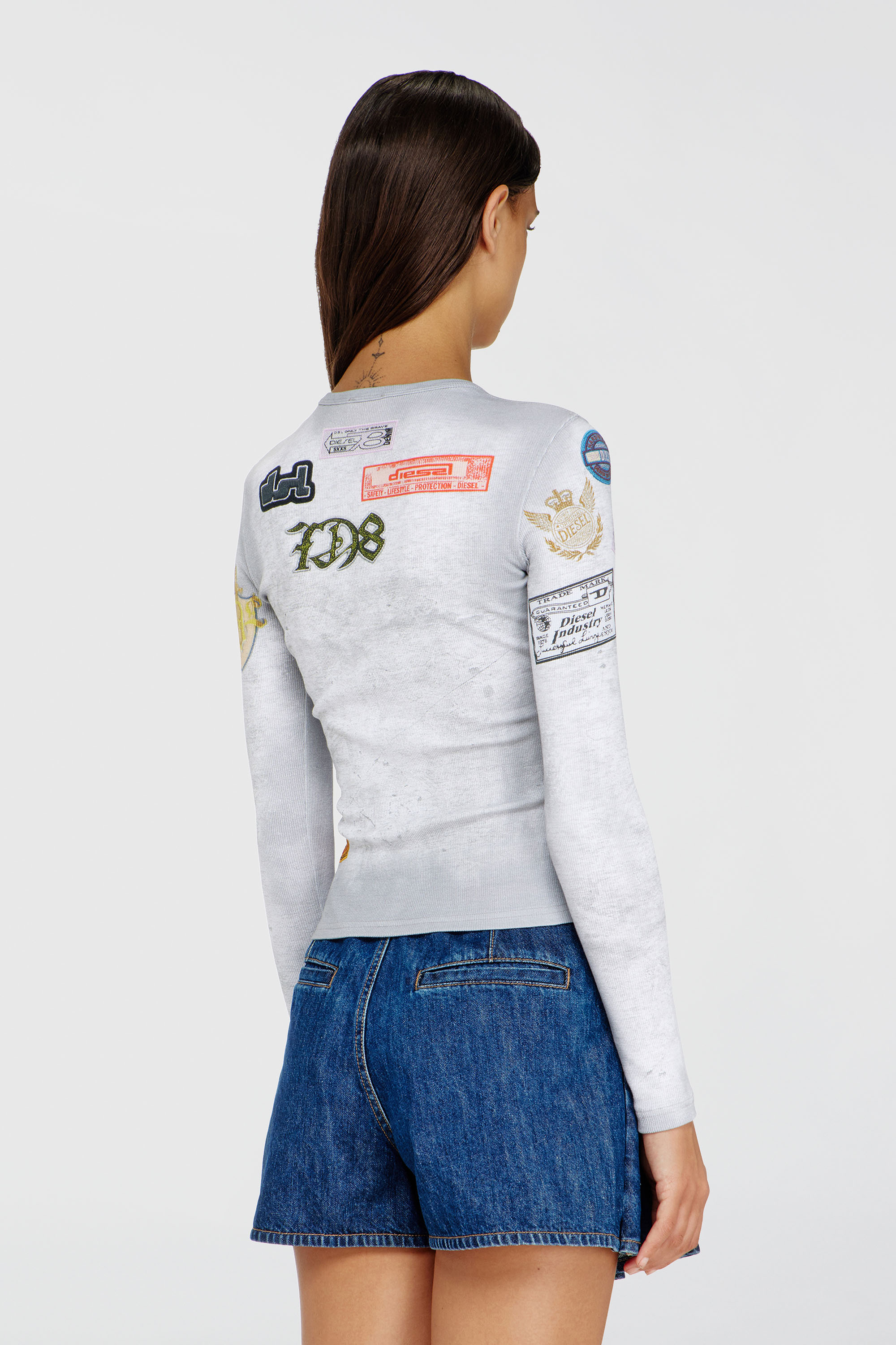 Diesel - T-ELE-LONGSLEEVE, Top in jersey a costine con stampa patch all-over Donna in Bianco - 4